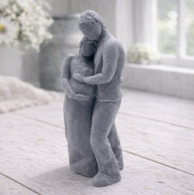 Load image into Gallery viewer, A 3D handmade vegan soap in a warm cream tone, sculpted into a standing figure of a pregnant couple; the partner stands behind the expectant mother, tenderly cradling her baby bump, displayed on a light wooden surface in a bright farmhouse setting.