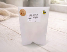 Load image into Gallery viewer, White soap packaging with a label on a light wooden surface