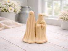 Load image into Gallery viewer, handmade vegan soap featuring a ghostly bride with a bouquet and a groom, a unique farmhouse decor wedding or anniversary gift