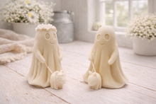Load image into Gallery viewer, Two white ghost vegan soaps with small dogs on a wooden surface with flowers in the background