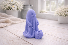 Load image into Gallery viewer, Blue ghost-shaped vegan soap with a small purple horse on a wooden floor.