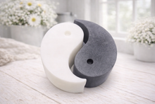 Load image into Gallery viewer, A handmade vegan soap gift set featuring two interlocking teardrop-shaped bars in contrasting black and white to form a large yin and yang symbol, displayed on a light wooden surface.