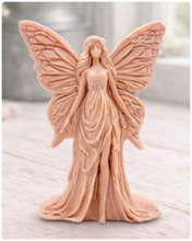 Load image into Gallery viewer, A detailed handmade vegan soap featuring an elegant fairy with large, intricate butterfly-style wings, a flowing gown, and long hair, standing against a bright farmhouse window background.