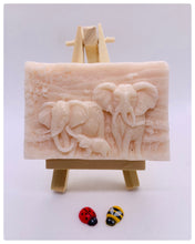Load image into Gallery viewer, Elephant Gift | unique elephant Gift. Zro waste gift. Modern gift ideas. Etsy Uk. Handmade home style. How beautiful is this Elephant Family soap? Featuring Mum, Dad, and Baby Elephant, each bar is exquisitely detailed, capturing the gentle spirit of these majestic animals.
Our soap is vegan, cruelty-free, and made with natural French clays and luxurious essential oils, offering a rich, soothing cleanse for your skin. The earthy tones and soft scents will transport you to nature, making bath time a serene