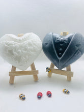 Load image into Gallery viewer, Handmade vegan soaps featuring a charcoal groom soap and a detailed bride soap. gift boxed in beautiful eco friendly packaging. crafted with natural French clays, activated charcoal and essential oils. a eco-friendly, zero waste gift that’s cruelty-free, skin-nourishing, the perfect gift for any wedding. UK Small Business