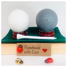Load image into Gallery viewer, Handmade vegan soaps shaped as two golf balls, gift boxed in beautiful eco friendly packaging. crafted with natural French clays, activated charcoal and essential oils. a eco-friendly, zero waste gift that’s cruelty-free, skin-nourishing, and perfect for golf lovers and gifting . Small business UK