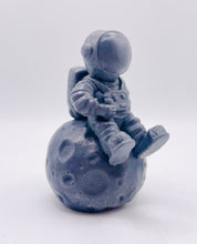 Load image into Gallery viewer, Handmade vegan soaps featuring a detailed astronaut / spaceman sitting  on the moon. crafted with natural French clays, activated charcoal and essential oils. a eco-friendly, zero waste gift that’s cruelty-free, skin-nourishing, and perfect for space lover gifts. gifts for him. Wrapped in beautiful eco friendly packaging. Small Business UK
