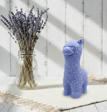Load image into Gallery viewer, highly detailed handmade vegan soap in the shape of a cute alpaca or llama with a textured woolly finish, displayed against a whimsical farmhouse decor background
