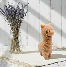Load image into Gallery viewer, A highly detailed handmade vegan soap in the shape of a cute alpaca or llama with a textured woolly finish, displayed against a whimsical farmhouse decor background
