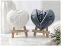 A pair of heart-shaped wedding soaps shaped like a bride's white lace dress and a groom's grey tuxedo, displayed on small wooden easels. Gift boxed ready to give. 