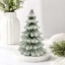 Load image into Gallery viewer, vegan soap sculpted into a realistic evergreen Christmas tree with multiple layers of textured, needle-like branches, with a subtle snow-dusted effect.
