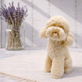 Cockapoo dog design vegan soap gift  on a light surface with a vase of lavender in the background