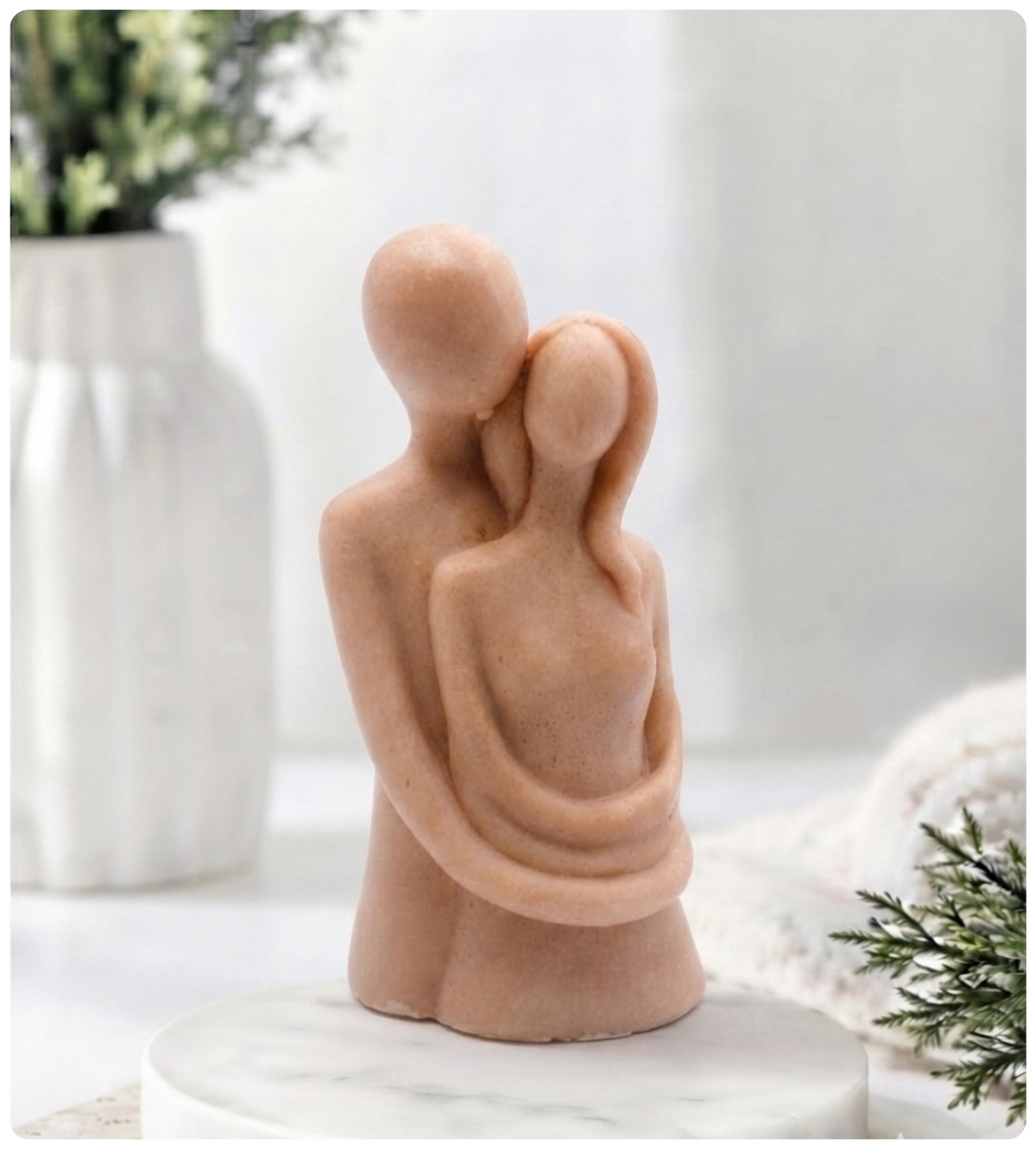 Handmade vegan soaps featuring a man embracing a woman, in beautiful eco friendly packaging.