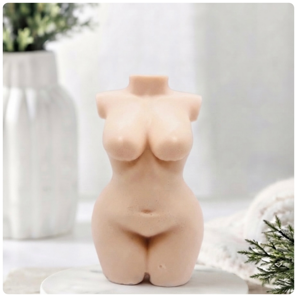 A handmade vegan soap in the shape of a curvaceous female goddess torso, featuring a detailed sculptural design, perfect for aesthetic farmhouse decor or a body-positive gift.