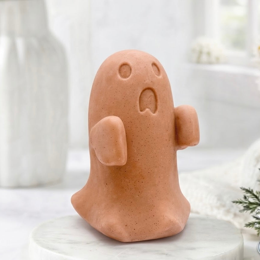 Terracotta coloured ghost soap gift on a marble base.