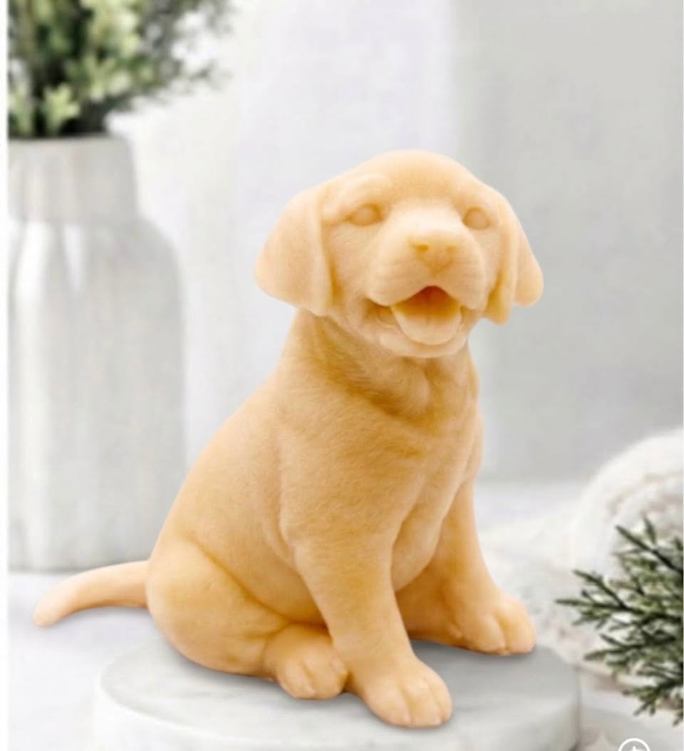 Front view of a warm golden yellow French clay handmade Labrador puppy dog vegan soap bar, showing the tail and textured coat detail.