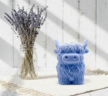 Load image into Gallery viewer, Large handmade vegan soap in the shape of a fluffy Highland cow calf with a detailed, shaggy coat, displayed against a whimsical farmhouse decor background.
