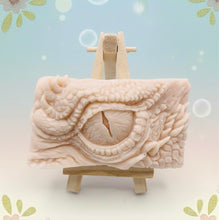 Load image into Gallery viewer, dragon Gift | dragon eye gift, dino gift, alternative gift, Dragon / Dinosaur Eye Vegan Soap Wooden display easels are available to purchase on a separate listing  Calling all fantasy lovers! Step into a realm of mystical charm with our captivating dragon / dinosaur eye soap. This soap is vegan, cruelty free and available in your choice of colour and essential oil. All our soaps are made with natural clays and essential oils to gently cleanse and nourish your skin. eco conscious gift
