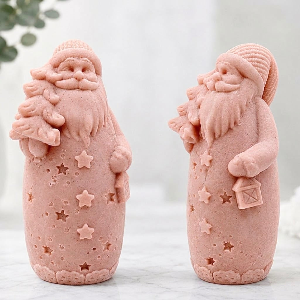 Handmade pink coloured Santa Christmas soap decorated with stars, holding a miniature Christmas tree and holding a lantern.