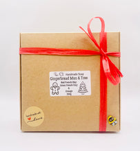 Load image into Gallery viewer, Handmade vegan soaps shaped as a gingerbread man and a Christmas’s tree, gift boxed. crafted with natural French clays, activated charcoal and essential oils. a eco-friendly, zero waste gift that’s cruelty-free, skin-nourishing, and perfect for secret Santa and Christmas gifting . small business UK
