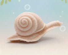 Load image into Gallery viewer, Handmade vegan soaps featuring a detailed snail, in beautiful eco friendly packaging. crafted with natural French clays, activated charcoal and essential oils. a eco-friendly, zero waste gift that’s cruelty-free, skin-nourishing, the perfect gift for snail lovers, gardeners or for animal lovers. small business UK
