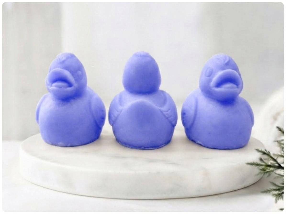Lavender blue artisanal vegan soap duck gift set with three detailed duck sculptures.