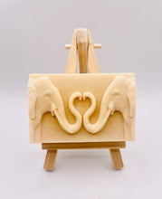 Load image into Gallery viewer, Handmade vegan soaps featuring two elephants who&#39;s trunks meet in a heart shape packed in beautiful eco friendly packaging. crafted with natural French clays, activated charcoal and essential oils. a eco-friendly, zero waste gift that’s cruelty-free, skin-nourishing, and perfect for elephant lovers or animal themed gifts. Small business UK
