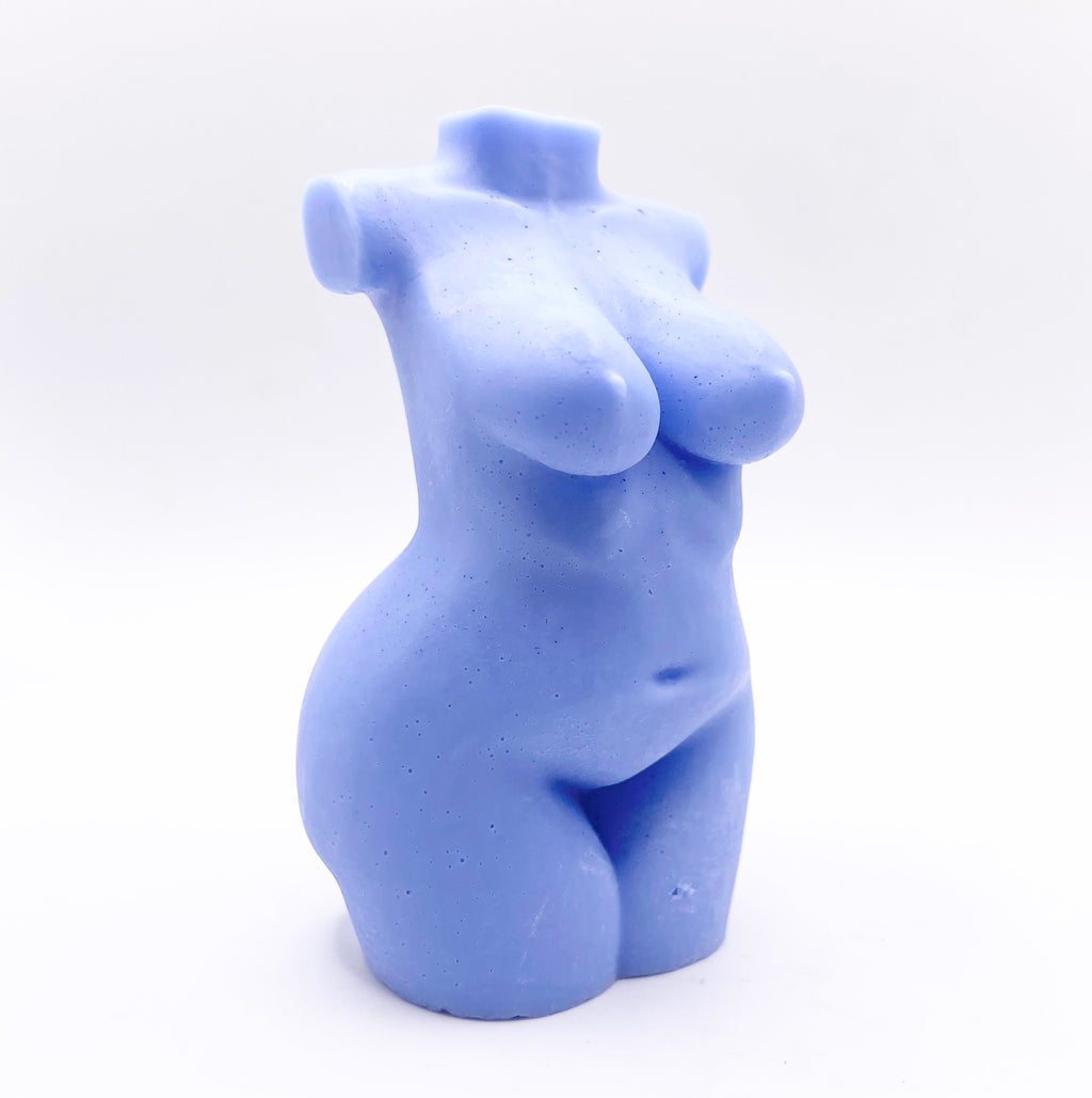 A handmade vegan soap in the shape of a curvaceous female goddess torso, featuring a detailed sculptural design, perfect for aesthetic farmhouse decor or a body-positive gift.