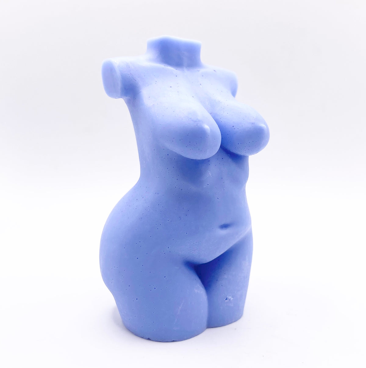 A handmade vegan soap in the shape of a curvaceous female goddess torso, featuring a detailed sculptural design, perfect for aesthetic farmhouse decor or a body-positive gift.
