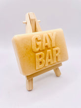 Load image into Gallery viewer, Handmade vegan soaps featuring the wording GAY BAR novelty gift. crafted with natural French clays, activated charcoal and essential oils. a eco-friendly, zero waste gift that’s cruelty-free, skin-nourishing, and perfect for pride gifts and LGBTQ gifts, hen party favours. wrapped in beautiful eco friendly packaging. 
