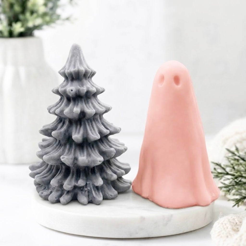 Handmade vegan soap gift set featuring a detailed grey Christmas tree soap alongside a soft pink ghost soap on a marble display tray.