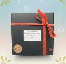 Load image into Gallery viewer, Handmade vegan soaps featuring a ghost and christmas tree gift boxed in beautiful eco friendly packaging crafted with natural French clays, activated charcoal and essential oils. a eco-friendly, zero waste gift that’s cruelty-free, skin-nourishing, and perfect for creepmas gifts and horror gifts. small business UK
