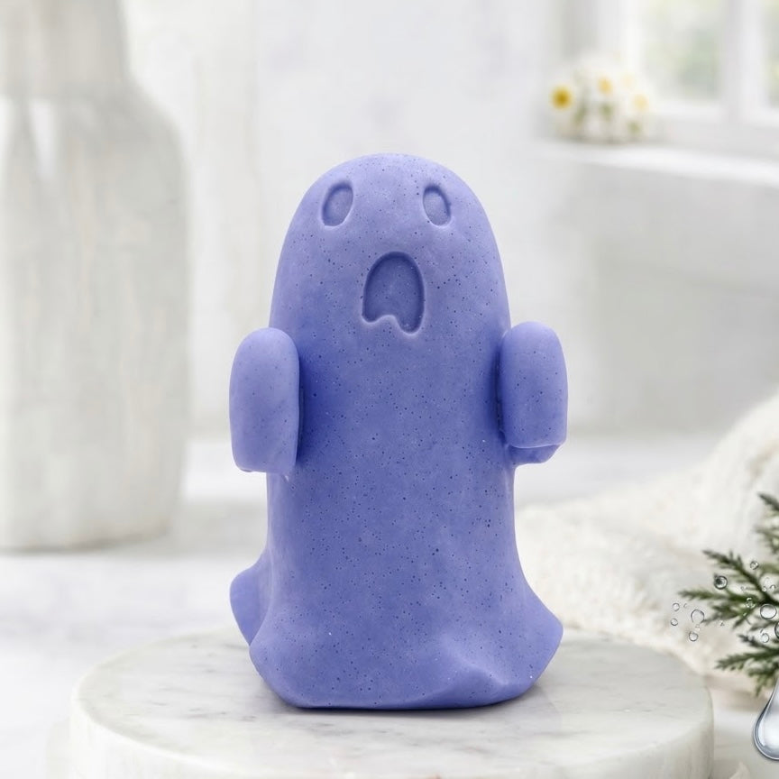 A front view of a soft blue ghost soap gift on a marble base.