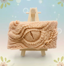 Load image into Gallery viewer, dragon Gift | dragon eye gift, dino gift, alternative gift, Dragon / Dinosaur Eye Vegan Soap Wooden display easels are available to purchase on a separate listing  Calling all fantasy lovers! Step into a realm of mystical charm with our captivating dragon / dinosaur eye soap. This soap is vegan, cruelty free and available in your choice of colour and essential oil. All our soaps are made with natural clays and essential oils to gently cleanse and nourish your skin. eco conscious gift
