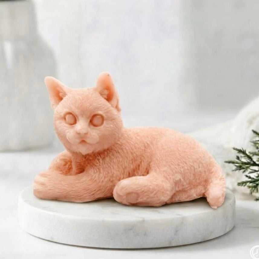 Light pink cat-shaped soap on a round marble display