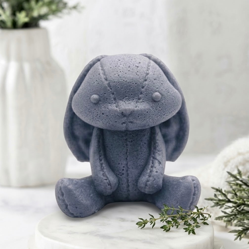 Handmade charcoal grey vegan soap featuring an adorable rabbit with big floppy ears and stitching detail