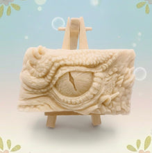 Load image into Gallery viewer, dragon Gift | dragon eye gift, dino gift, alternative gift, Dragon / Dinosaur Eye Vegan Soap Wooden display easels are available to purchase on a separate listing  Calling all fantasy lovers! Step into a realm of mystical charm with our captivating dragon / dinosaur eye soap. This soap is vegan, cruelty free and available in your choice of colour and essential oil. All our soaps are made with natural clays and essential oils to gently cleanse and nourish your skin. eco conscious gift
