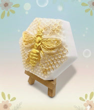 Load image into Gallery viewer, Handmade vegan soap with a detailed gold bee and honeycomb design
