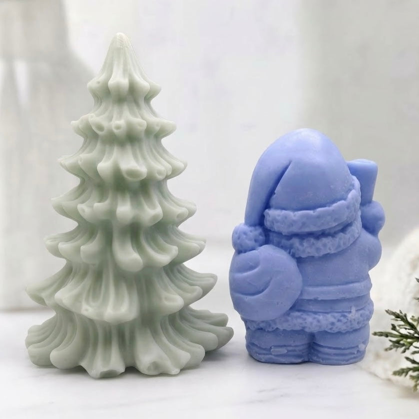 Colorful holiday soap duo: green Christmas Tree and lavender Santa figurine. Adds a playful and practical touch to the bathroom.