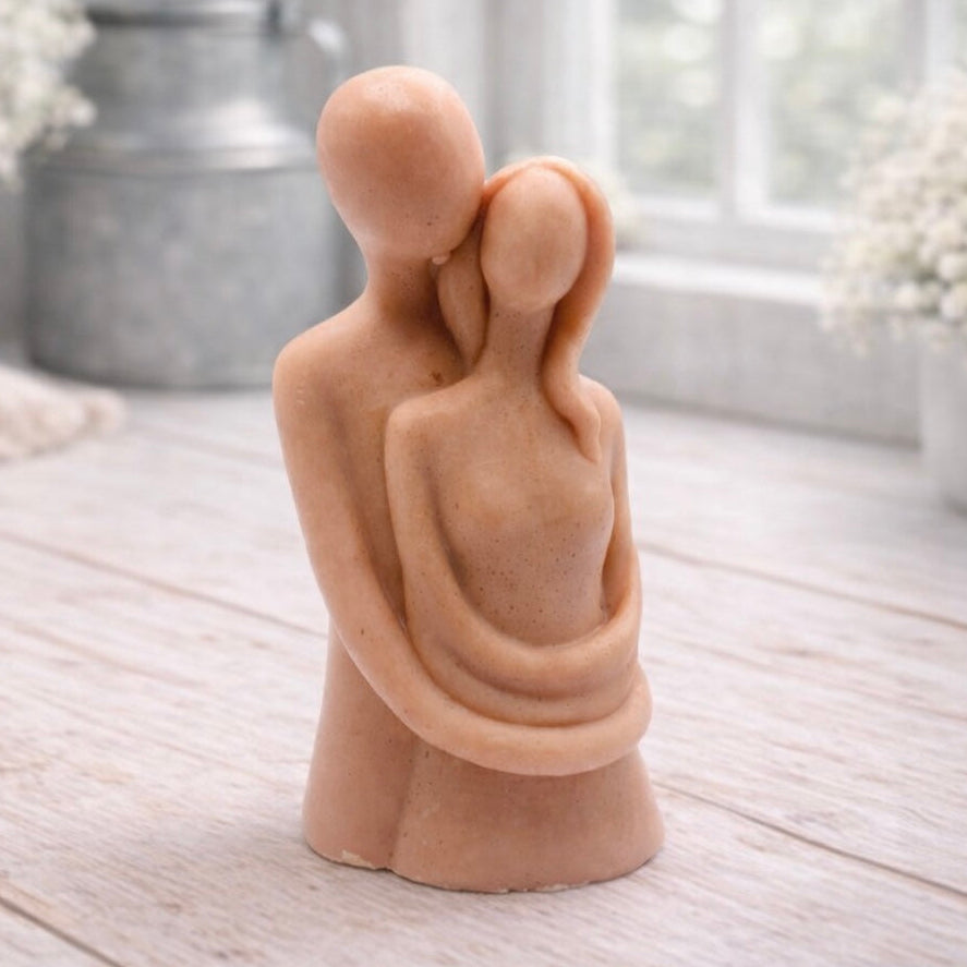 Handmade vegan soaps featuring a man embracing a woman, in beautiful eco friendly packaging.