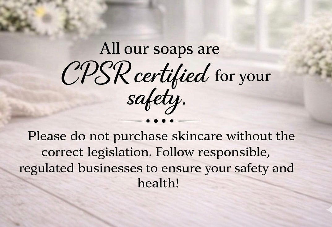 Text on a wooden surface with soap bars and flowers, emphasising CPSR certification for safety.
