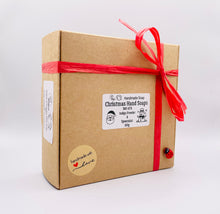 Load image into Gallery viewer, Christmas Themed Vegan Hand Soaps  Gift Boxed  Give the gift of clean hands! This set of six Christmas themed hand soaps make the perfect secret Santa, stocking filler and friendship gifts! Each set contains a Santa, a candy cane, snowflake, gift box, gingerbread man, snowman, and a Christmas tree. (Yes, they’re almost too cute to use… almost.)  Available in your choice of French clay and essential oil: modern gifts. zero waste gifts UK. handmade gifts UK. Handmade home style UK. BrIrish made. Handmade UK. 

