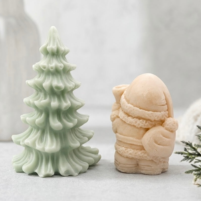 Green Christmas Tree soap and cream Santa Claus figurine soap set on a marble surface. Charming holiday home decor and practical gift