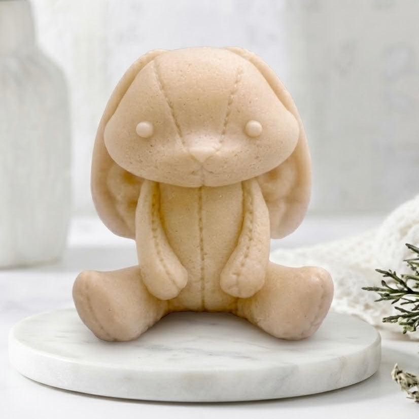 Handmade soft yellow vegan soap featuring an adorable rabbit with big floppy ears and stitching detail