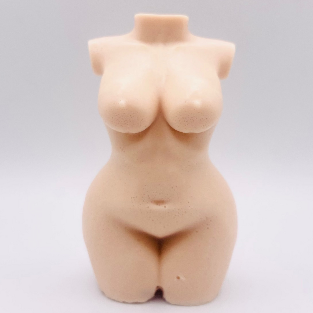 A handmade vegan soap in the shape of a curvaceous female goddess torso, featuring a detailed sculptural design, perfect for aesthetic farmhouse decor or a body-positive gift.