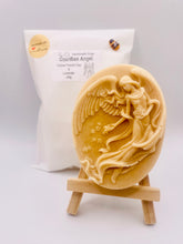 Load image into Gallery viewer,  Handmade vegan Guardian Angel soap bar, features a detailed angel with flowing wings. Natural, cruelty-free UK soap ideal for spiritual gifts, zero waste skincare, and sustainable bathroom décor. British-made artisan soap perfect for eco-conscious shoppers. Wrapped in beautiful eco friendly packaging . Small business UK
