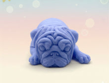 Load image into Gallery viewer, Handmade vegan soap featuring sleepy pug lying down and packed in beautiful eco friendly packaging. crafted with natural French clays, activated charcoal and essential oils. a eco-friendly, zero waste gift that’s cruelty-free, skin-nourishing, and perfect for pug owners, dog lovers or animal themed gifts. Small business UK
