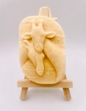 Load image into Gallery viewer, Handmade vegan soaps shaped as two nuzzling giraffes. crafted with natural French clays, activated charcoal and essential oils. a eco-friendly, zero waste gift that’s cruelty-free, skin-nourishing, and perfect for animal lovers and gifting . Beautifully wrapped in eco friendly packaging. Small business UK
