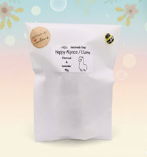 Load image into Gallery viewer, Handmade vegan soap featuring a cute detailed alpaca / llama. crafted with natural French clays, activated charcoal and essential oils. a eco-friendly, zero waste gift that’s cruelty-free, skin-nourishing, and perfect for animal lovers and llama alpaca lovers. Small Business UK
