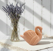 Load image into Gallery viewer, A beautiful handmade vegan soap in the shape of a graceful swan with detailed wing feathers, displayed against a whimsical background for an elegant farmhouse decor gift. 
